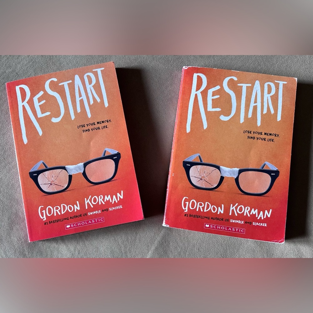 Set of 2 Books by Gordon Korman “Restart” New York Times Bestseller Ages 10-12